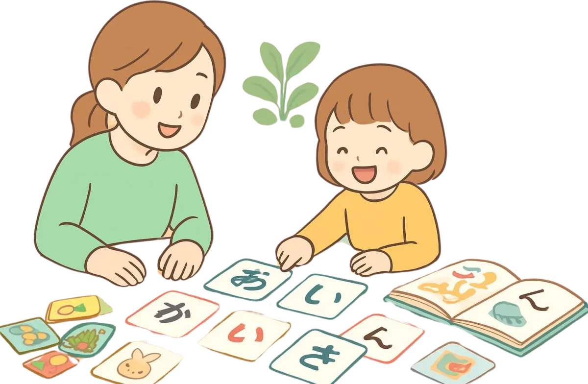 ひらがなカードやカルタ、絵本を使って遊びながら学ぶ子どもの様子